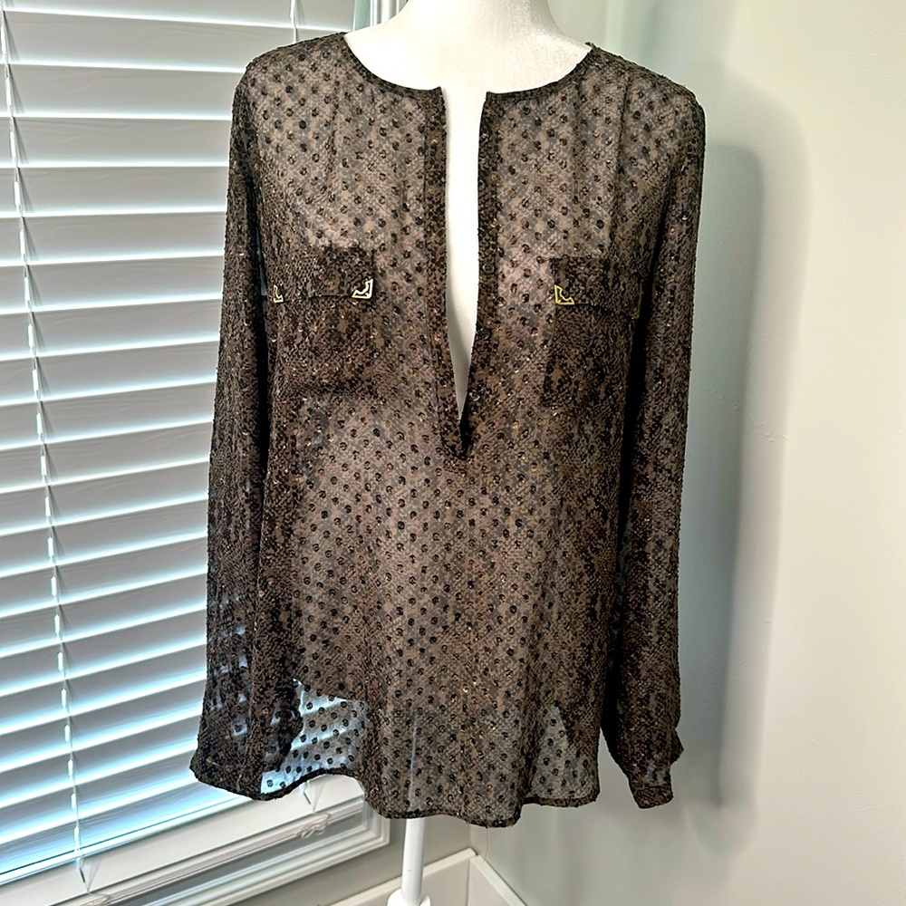 Gorgeous blouse by Outback Red XL 100% washable and tumble dry polyester.